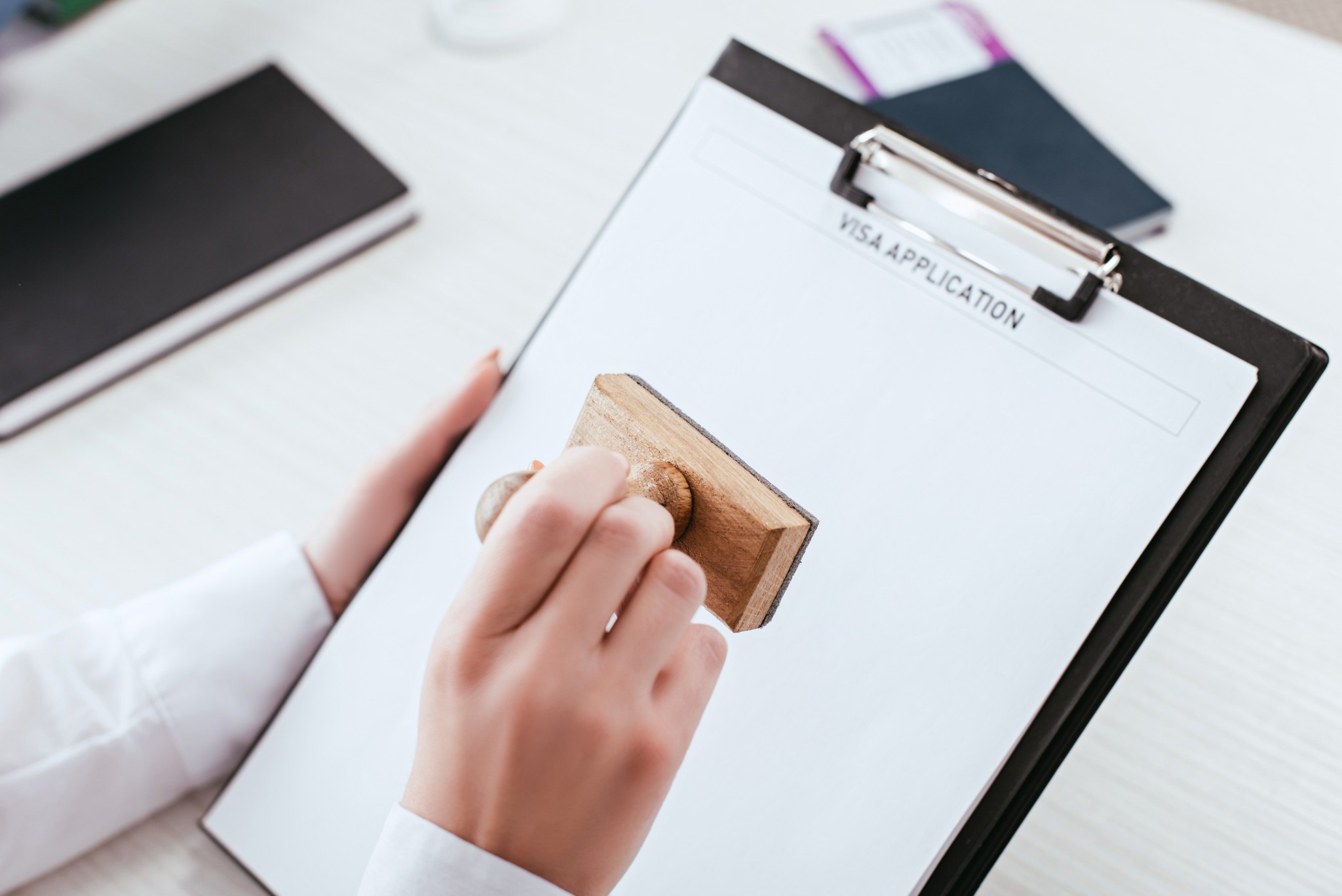 Selective Focus Of Female Lawyer With Stamp In Hand Holding Clipboard With Visa Application